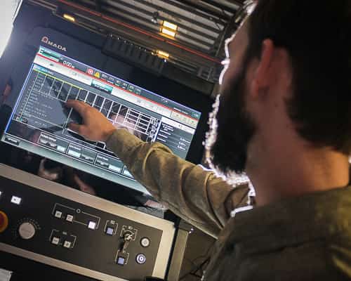 Camp employee working with automation computer