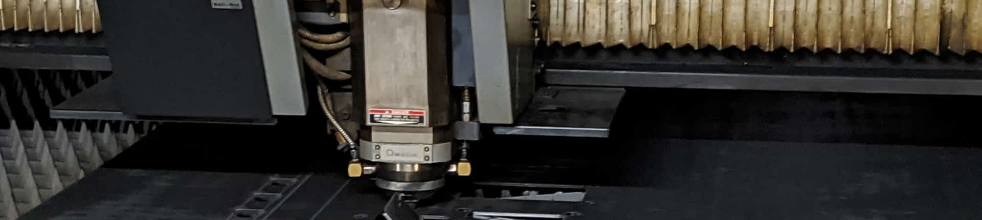 Large sheets, and pieces of metal on pallets.